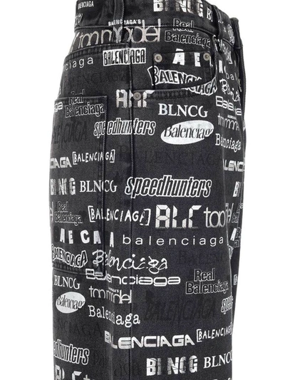 Shop Balenciaga Allover Logo Denim Jeans In Black