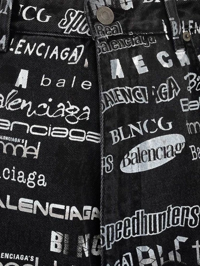 Shop Balenciaga Allover Logo Denim Jeans In Black