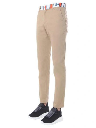 Shop Versace "compilation" Trousers In Beige