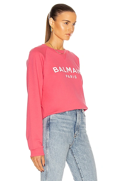 Shop Balmain Printed Logo Sweatshirt In Rose & Blanc