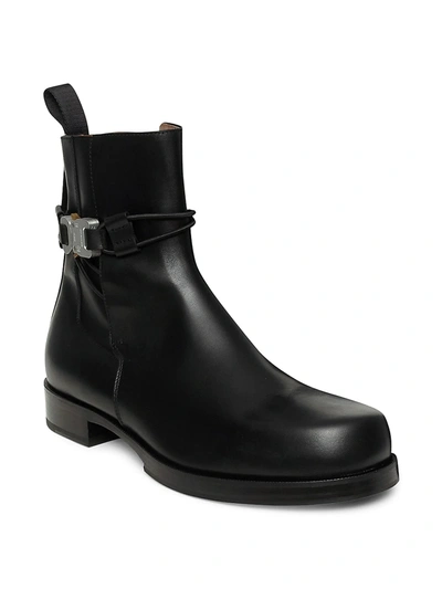 Shop Alyx Low Buckle Leather Ankle Boots In Black
