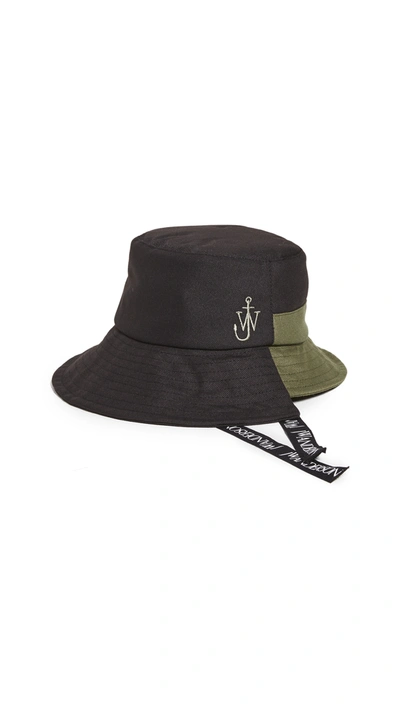 Shop Jw Anderson Asymmetric Bucket Hat In Black/green