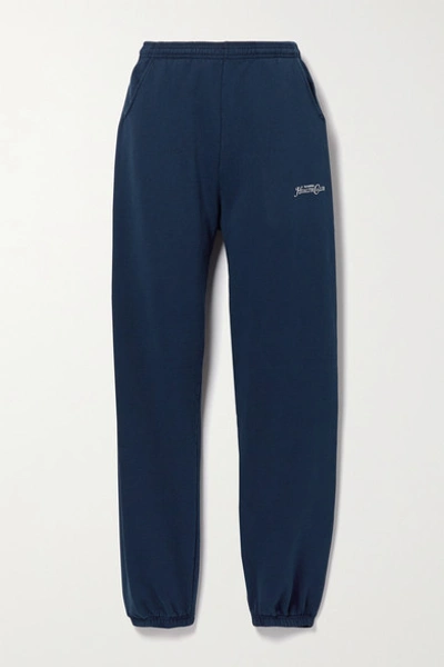 Shop Sporty And Rich Rizzoli Printed Cotton-jersey Track Pants In Navy