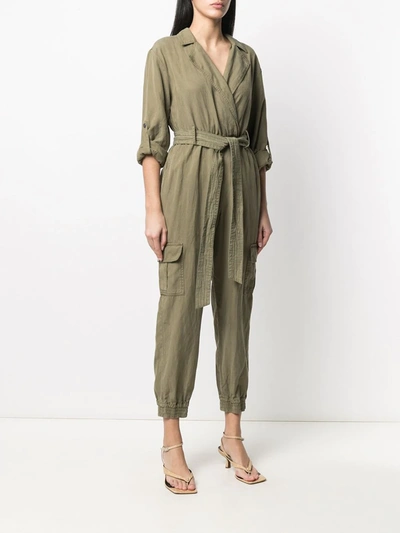 Shop Alice And Olivia Wrap-front Belted Jumpsuit In Green