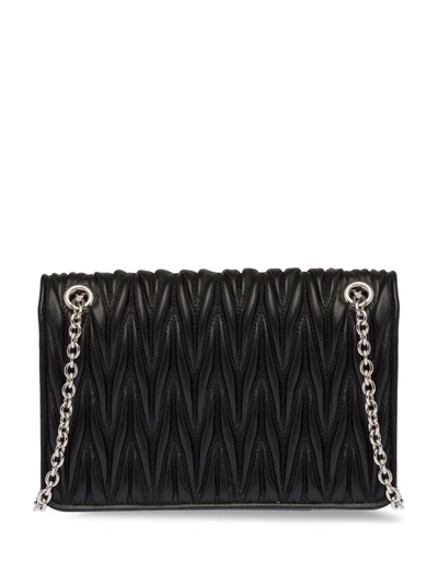 Shop Miu Miu Crystal-embellished Matelassé Leather Cross-body Bag In Black