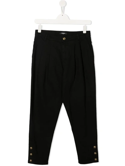 Shop Balmain Button-embellished Tapered Trousers In Black