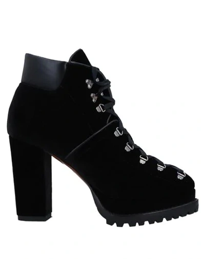 Shop Alaïa Ankle Boots In Black