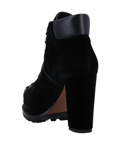 Shop Alaïa Ankle Boots In Black