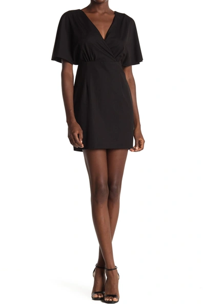 Shop Adelyn Rae Surplice Neck Flutter Sleeve Mini Dress In Black