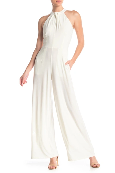 Shop Nina Leonard Twist Halter Knit Jumpsuit In Ivory