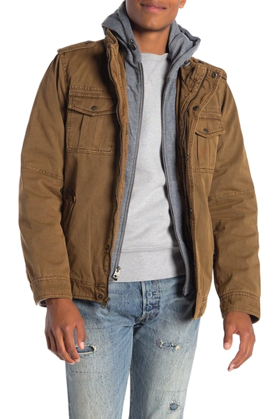 Shop Levi's Washed Cotton Faux Shearling Lined Hooded Military Jacket In Brown