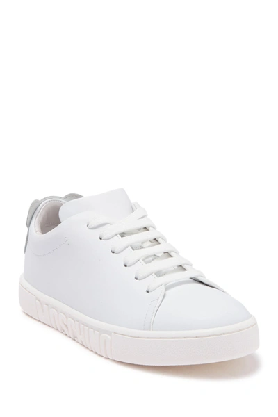 Shop Moschino Logo Embossed Sneaker In White Silver