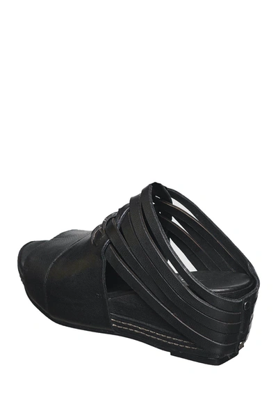 Shop Antelope Woven Leather Wedge Sandal In Black