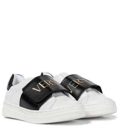 Shop Versace Logo Leather Sneakers In White