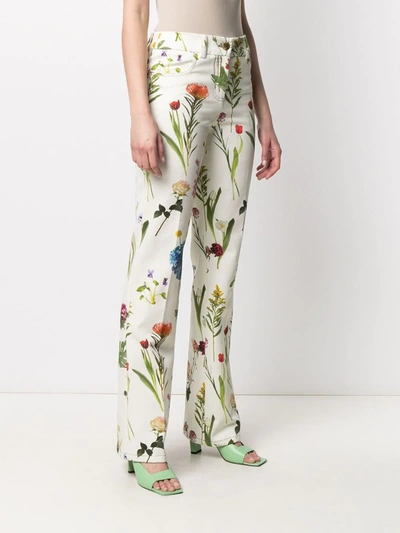 Shop Boutique Moschino Floral-print Low-rise Trousers In Green
