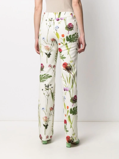 Shop Boutique Moschino Floral-print Low-rise Trousers In Green