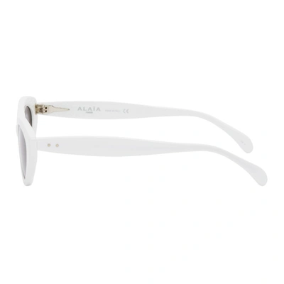 Shop Alaïa Alaia White Slim Cat Eye Sunglasses In 002 White