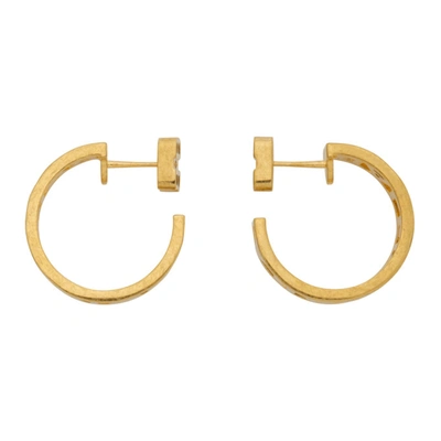 Shop Balenciaga Gold Logo Loop Earrings In 0705 Gold