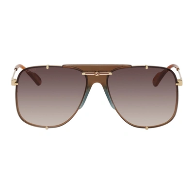 Shop Gucci Gold & Brown Bold Bridge Aviator Sunglasses In 002 Gold