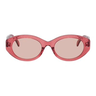 Shop Alaïa Pink Round Cat Eye Sunglasses In 005 Pink