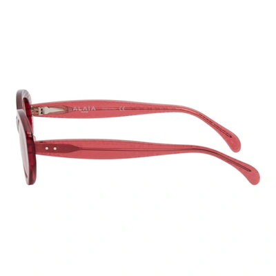 Shop Alaïa Pink Round Cat Eye Sunglasses In 005 Pink