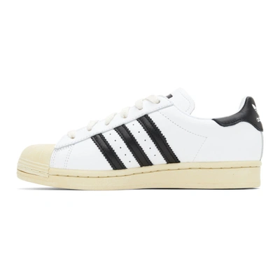 Shop Adidas Originals White Superstar Sneakers In Wht/blk/blu