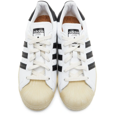 Shop Adidas Originals White Superstar Sneakers In Wht/blk/blu