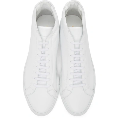 Shop Common Projects White Original Achilles Mid Sneakers In 0506 White