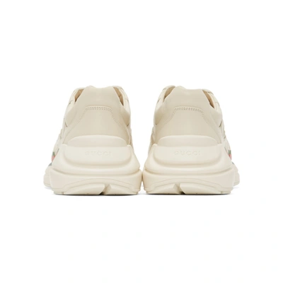 Shop Gucci Off-white Rhyton Logo Sneakers In 9522 Ivoire