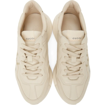 Shop Gucci Off-white Rhyton Logo Sneakers In 9522 Ivoire