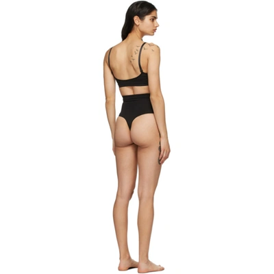 Shop Skims Black Core Control Thong In Onyx