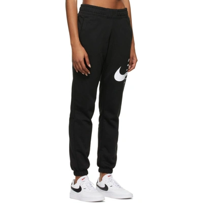 Shop Nike Black Sportswear Swoosh Lounge Pants In 011 Black