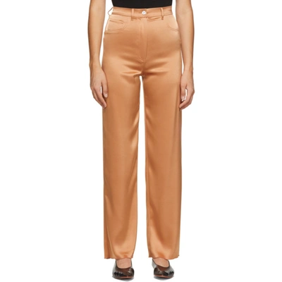 Shop Nanushka Orange Satin Drew Trousers In Apricot