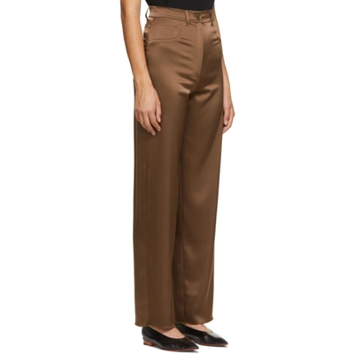 Shop Nanushka Brown Satin Drew Trousers