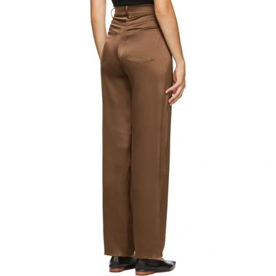 Shop Nanushka Brown Satin Drew Trousers
