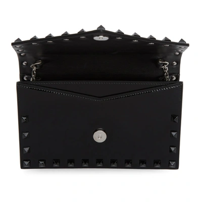 Shop Valentino Black  Garavani Patent Rockstud Envelope Wallet Bag In 0no Black