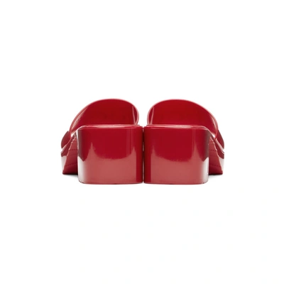 Shop Gucci Red Rubber Logo Mules In 6433 Red