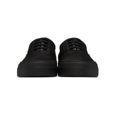 Shop Common Projects Black Canvas Four Hole Sneakers In 7547 Black