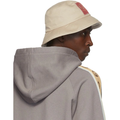 Shop Gucci Beige Label Bucket Hat In 1400 Lead