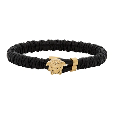 Shop Versace Black And Gold Leather Medusa Bracelet In D41o Black/