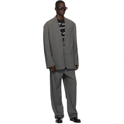 Shop Balenciaga Black & White Check Baggy Trousers In 1070black/