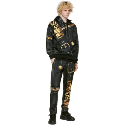 Shop Moschino Black & Gold Leather Print Hoodie In A1555 Black