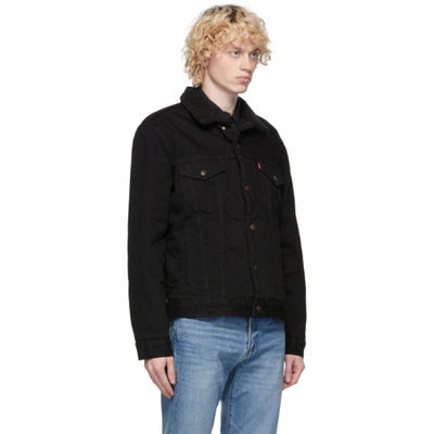 Shop Levi's Black Denim Sherpa Trucker Jacket In Berk