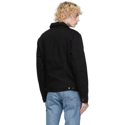 Shop Levi's Black Denim Sherpa Trucker Jacket In Berk