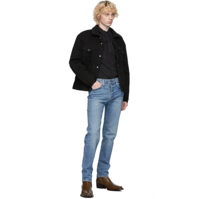 Shop Levi's Black Denim Sherpa Trucker Jacket In Berk