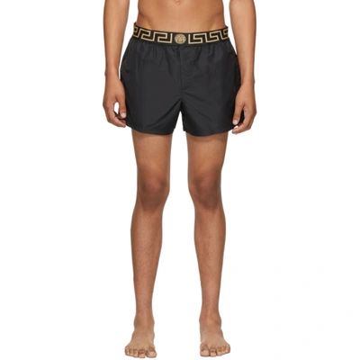 Shop Versace Black Greek Key Swim Shorts In A80g Black