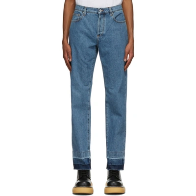 Shop Jw Anderson Blue Raw Hem Slim Jeans In Dnimblu820