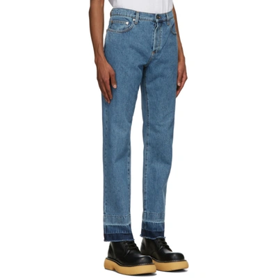 Shop Jw Anderson Blue Raw Hem Slim Jeans In Dnimblu820