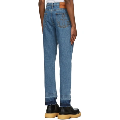 Shop Jw Anderson Blue Raw Hem Slim Jeans In Dnimblu820