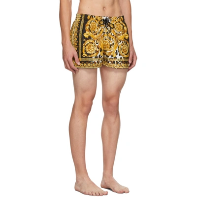 Shop Versace Gold & Black Barocco Swim Shorts In A7900 Black